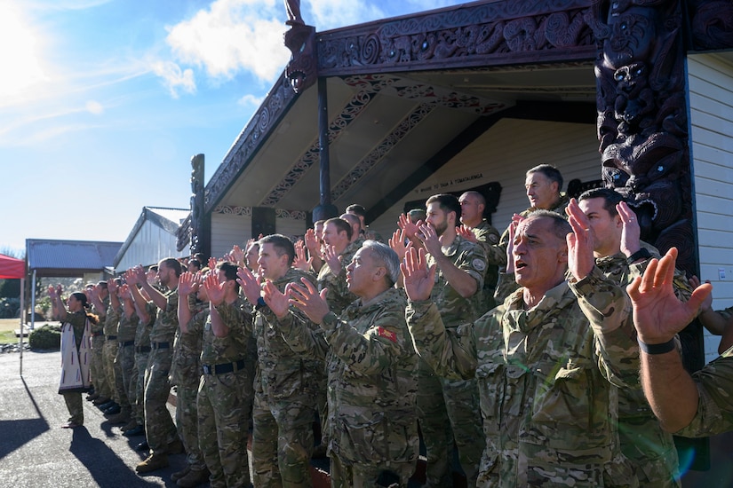 A New Zealand Army contingent performs a haka to welcome the US delegation onto its marae in Waiouru.
