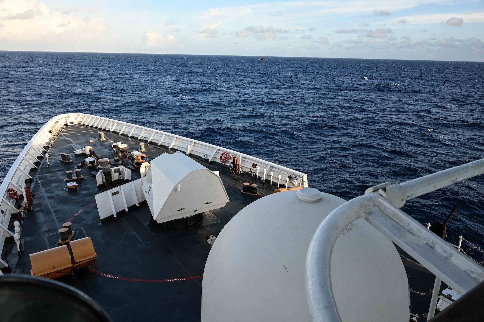 A fishing vessel operates off the starboard bow of the Legend-class U.S. Coast Guard Cutter Stratton (WMSL 752), within the Republic of the Marshall Islands (RMI) exclusive economic zone, July 10, 2025. The U.S. Coast Guard and the RMI have long cooperated to enhance maritime security and sovereignty in the Pacific with a focus on bilateral maritime law enforcement operations that help combat maritime trafficking and safeguard fisheries for both countries. (U.S. Coast Guard photo by Petty Officer 2nd Class Kate Kilroy)