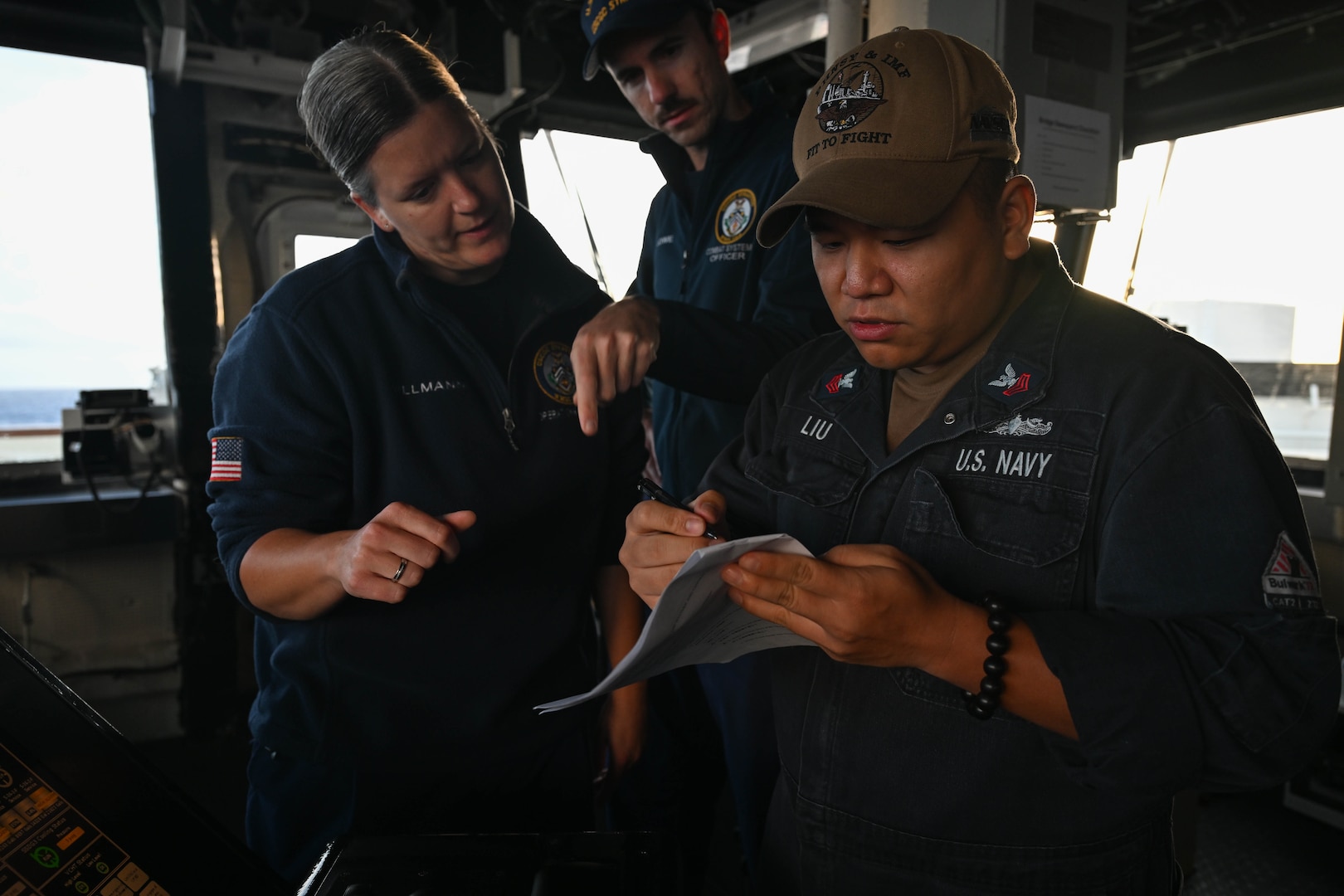 Legend-class U.S. Coast Guard Cutter Stratton (WMSL 752) operations and security officers work with a temporarily assigned crew member to query a fishing vessel crew within the Republic of the Marshall Islands (RMI) exclusive economic zone, July 10, 2025. The U.S. Coast Guard and the RMI have long cooperated to enhance maritime security and sovereignty in the Pacific with a focus on bilateral maritime law enforcement operations that help combat maritime trafficking and safeguard fisheries for both countries. (U.S. Coast Guard photo by Petty Officer 2nd Class Kate Kilroy)