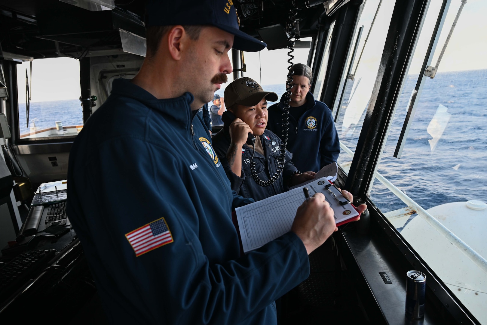 Legend-class U.S. Coast Guard Cutter Stratton (WMSL 752) operations crew members query a fishing vessel crew within the Republic of the Marshall Islands (RMI) exclusive economic zone, July 10, 2025. The U.S. Coast Guard and the RMI have long cooperated to enhance maritime security and sovereignty in the Pacific with a focus on bilateral maritime law enforcement operations that help combat maritime trafficking and safeguard fisheries for both countries. (U.S. Coast Guard photo by Petty Officer 2nd Class Kate Kilroy)