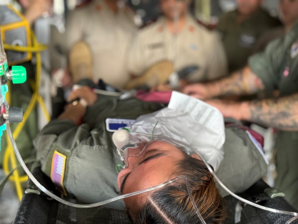 Algerian aeromedical personnel observe a U.S. Air Force 86th Aeromedical Evacuation Squadron technician and flight nurse simulate patient care during an Algerian aeromedical evacuation familiarization visit at Ramstein Air Base, Germany, July 17, 2025. The familiarization visit, led by the U.S. Air Forces in Europe – Air Forces Africa Command Surgeon’s Office of Global Health Engagements and the 86 Aeromedical Evacuation Squadron, provided an opportunity to exchange aeromedical training and best practices, serving as a foundation for future military healthcare cooperation.