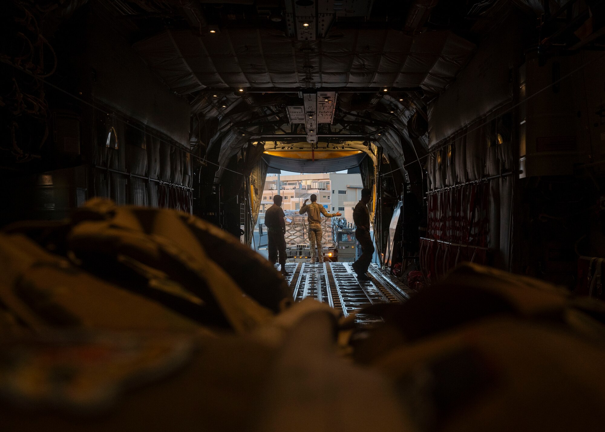 Airman performs pre-flight check on a C-130J