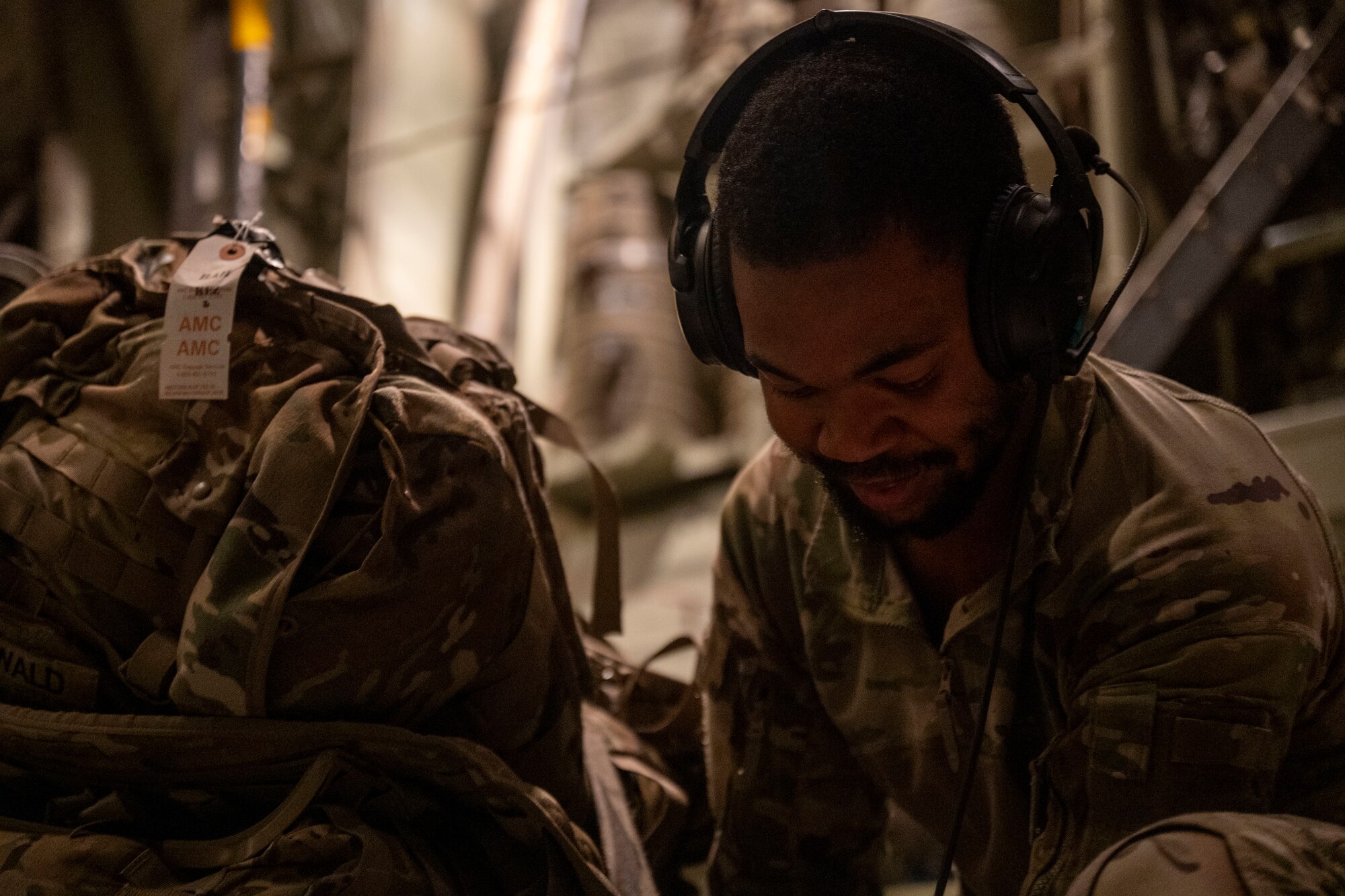 Airman performs pre-flight check on a C-130J