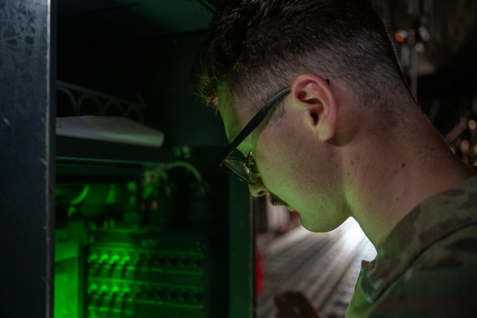 Airman performs pre-flight check on a C-130J