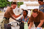 PUERTO PLATA, Dominican Republic (July 17, 2025) Hospital Corpsman 3rd Class Abby Marvin, assigned to the Mercy-class hospital ship USNS Comfort (T-AH 20), takes a Dominican patient’s temperature at a medical site in Puerto Plata, Dominican Republic during Continuing Promise 2025, July 17, 2025. Continuing Promise 2025 is the 16th iteration of the U.S. 4th Fleet/U.S. Naval Forces Southern Command-led mission since 2007, which aims to foster goodwill, strengthen existing partnerships with partner nations, and form new partnerships between host nations, non-federal entities, and international organizations. (U.S. Army photo by Cpl. William Hunter)