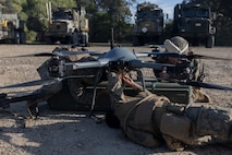 U.S. Marines Combat Logistics Company-Bravo, Combat Logistics Battalion 31, 31st Marine Expeditionary Unit, conduct a maintenance pre-flight check on a Tactical Resupply Unmanned Aircraft System during a resupply exercise at Sam Hill Airfield, Queensland, Australia, July 5, 2025. The TRUAS is a class 3 unmanned aerial vehicle that can deliver supplies to remote and inaccessible areas. The 31st MEU is operating aboard ships of the USS America Amphibious Ready Group in the 7th Fleet area of operations, the U.S. Navy’s largest forward-deployed numbered fleet, and routinely interacts and operates with allies and partners in preserving a free and open Indo-Pacific region. (U.S. Marine Corps photo by Lance Cpl. Skilah Sanchez)