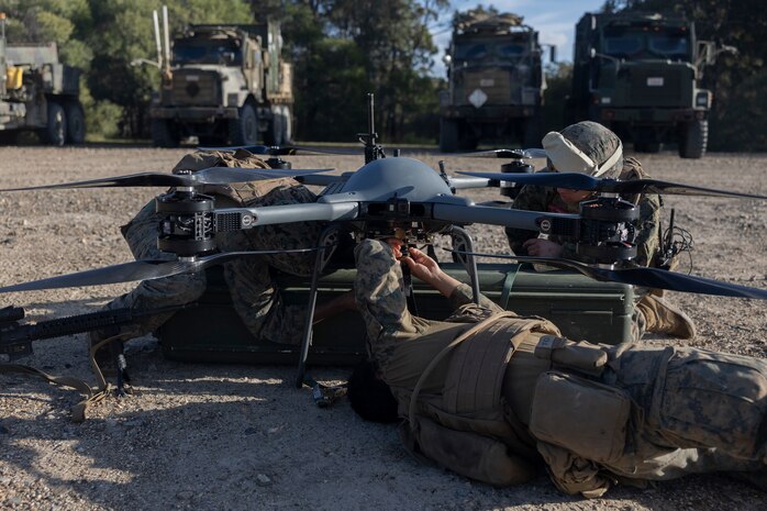 U.S. Marines Combat Logistics Company-Bravo, Combat Logistics Battalion 31, 31st Marine Expeditionary Unit, conduct a maintenance pre-flight check on a Tactical Resupply Unmanned Aircraft System during a resupply exercise at Sam Hill Airfield, Queensland, Australia, July 5, 2025. The TRUAS is a class 3 unmanned aerial vehicle that can deliver supplies to remote and inaccessible areas. The 31st MEU is operating aboard ships of the USS America Amphibious Ready Group in the 7th Fleet area of operations, the U.S. Navy’s largest forward-deployed numbered fleet, and routinely interacts and operates with allies and partners in preserving a free and open Indo-Pacific region. (U.S. Marine Corps photo by Lance Cpl. Skilah Sanchez)