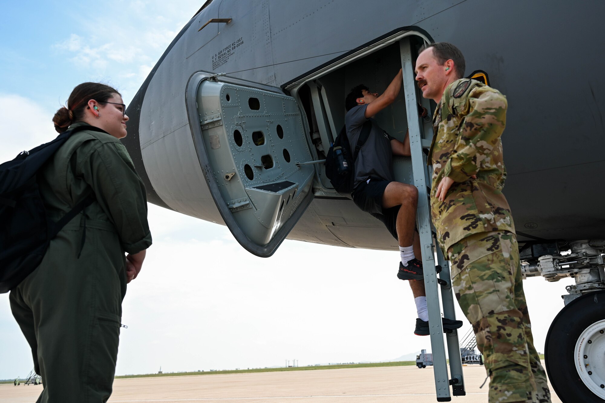 Aim High Flight Academy (AHFA) students board a KC-135 Stratotanker aircraft at Altus Air Force Base