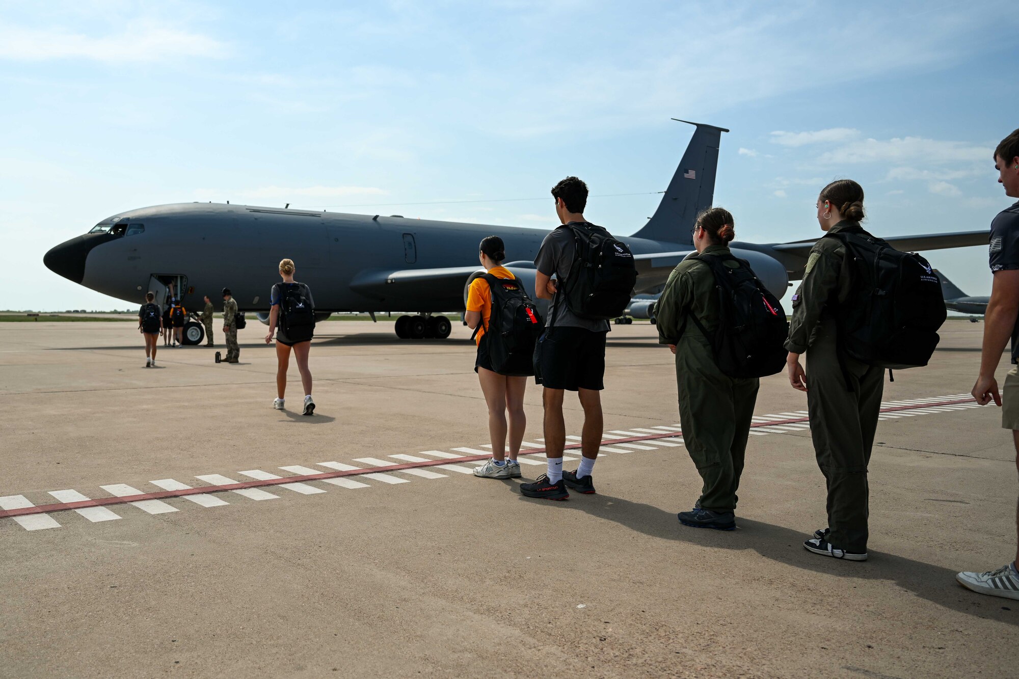 Aim High Flight Academy (AHFA) students prepare to board a KC-135 Stratotanker aircraft at Altus Air Force Base