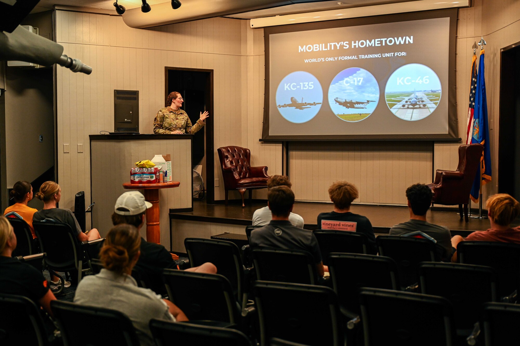 U.S. Air Force Capt. Elisabeth Teitelman, 97th Air Mobility Wing (AMW) chief of public affairs, briefs Aim High Flight Academy students on the wing’s mission at Altus Air Force Base