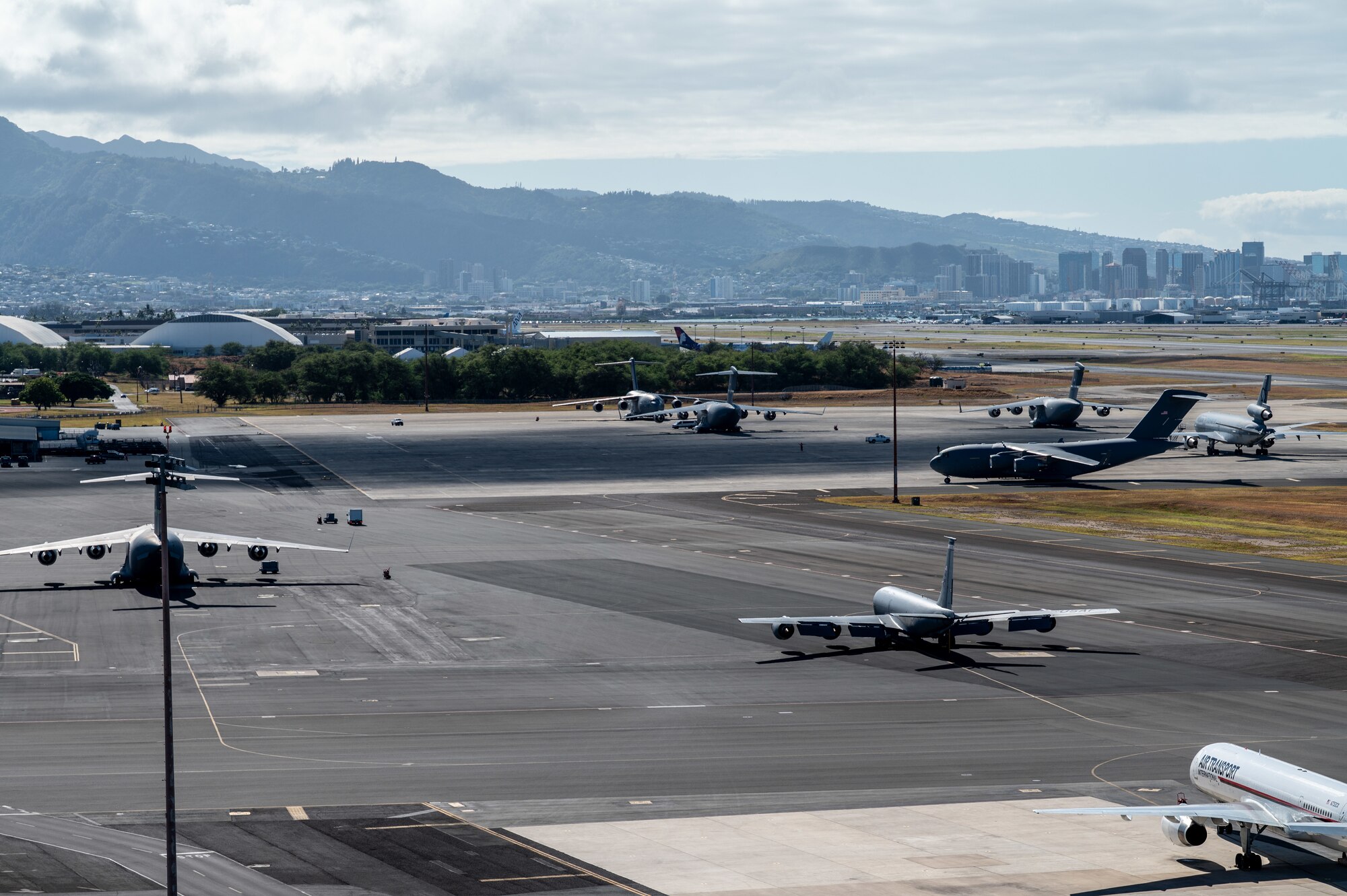 Overview photo of a flightline with military aircraft parked.