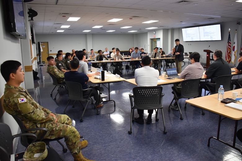 FED and MND-DIA employees at a joint symposium.