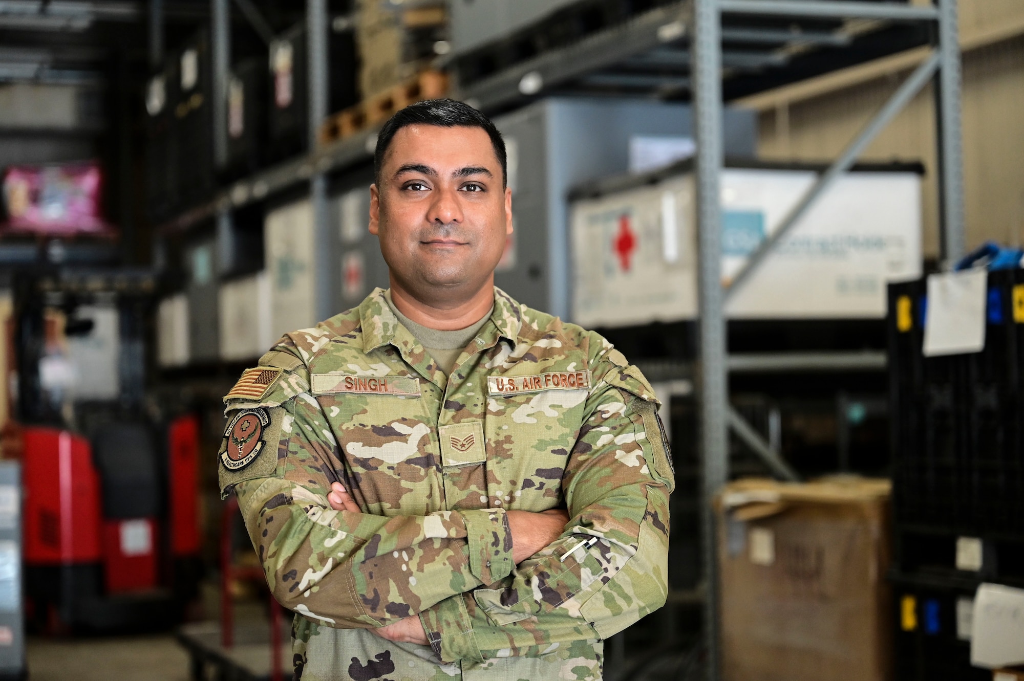 Staff Sgt. Mandeep Singh, 8th Healthcare Operations Squadron logistics operations section chief, poses for a photo in the 8th Medical Group’s logistics warehouse at Kunsan Air Base, Republic of Korea, July 23, 2025. Singh was chosen as the 8th Fighter Wing’s Pride of the Pack for the week of July 21-25 after filling a critical contract management noncommissioned officer in charge vacancy and boosting the 8th MDG emergency medication readiness.