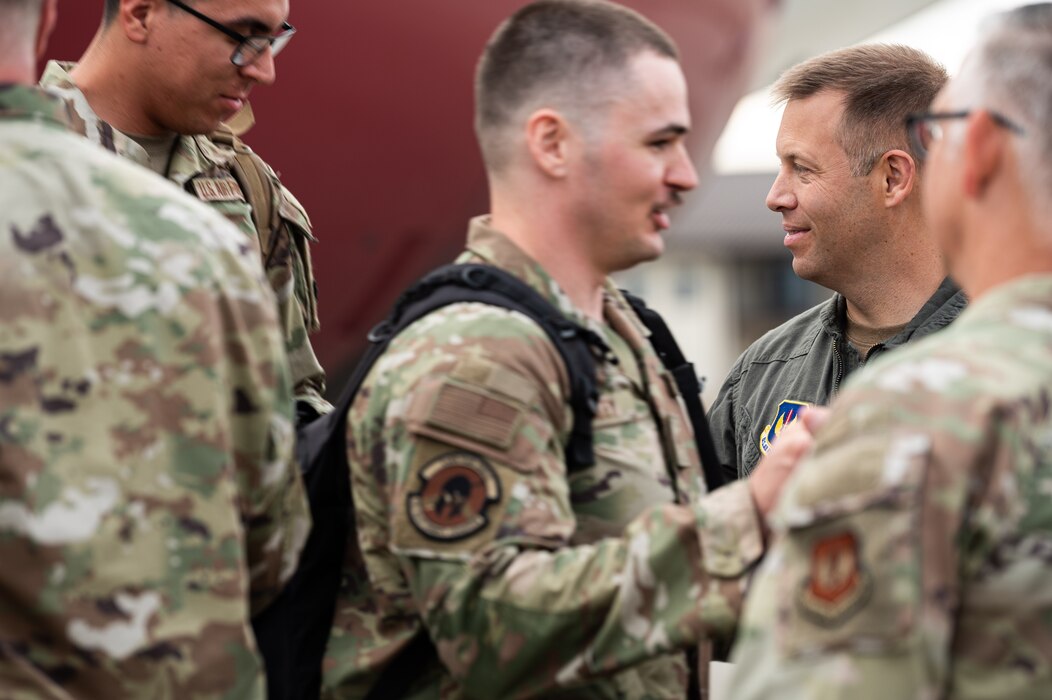 U.S. Air Force Airmen disembark an aircraft.