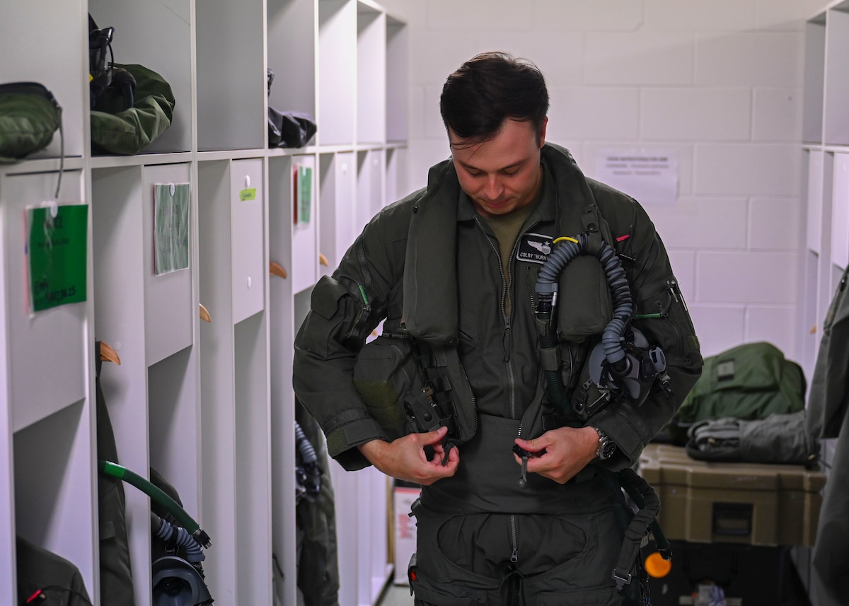 U.S. Air Force Maj. Colby “Burn” Kluesner, 388th Fighter Wing F-35A Lightning II Evaluator pilot, prepares for a flight during Talisman Sabre 25 in Northern Territory, Australia, July 16, 2025. Kluesner participated in an international interfly with the Royal Australian Air Force, marking a first for the USAF utilizing 5th Generation aircraft belonging to an Ally. Talisman Sabre is the largest bilateral military exercise between Australia and the United States, that advances a safe and secure Indo-Pacific by strengthening relationships and interoperability among key allies and partners, while enhancing our collective capabilities to respond to a wide array of potential security concerns. (U.S. Air Force photo by Airman 1st Class Joseph Maye)