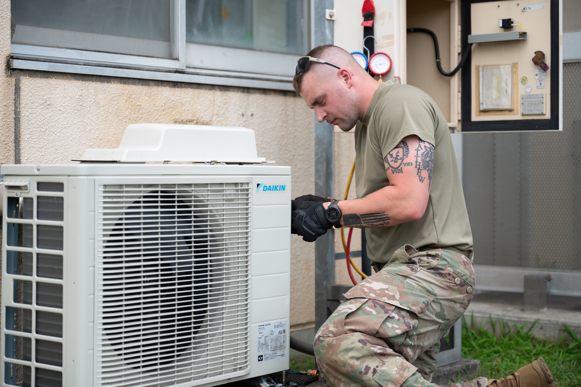 Airman fixes an HVAC system.
