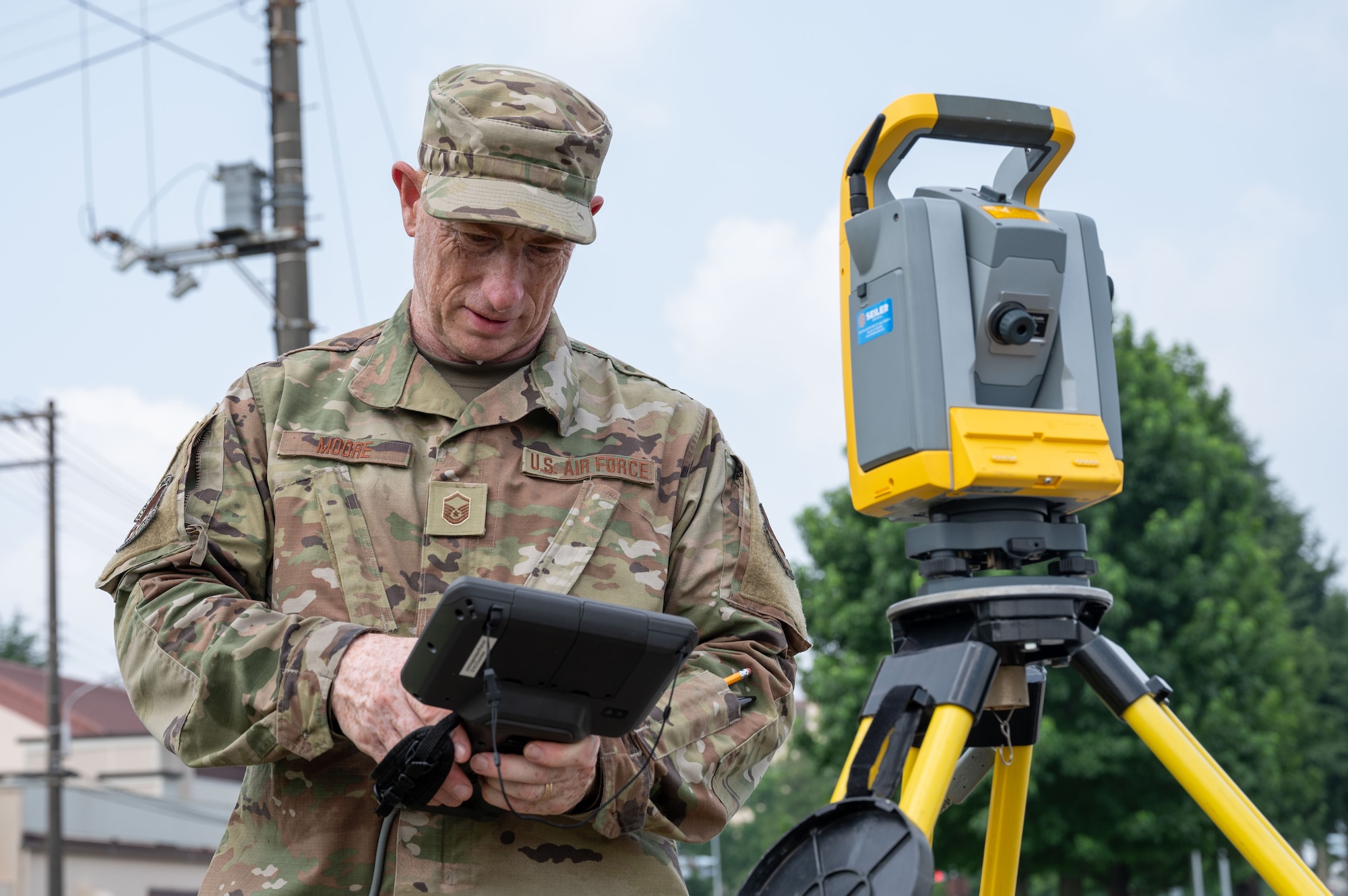 Airman conducts a manhole survey.
