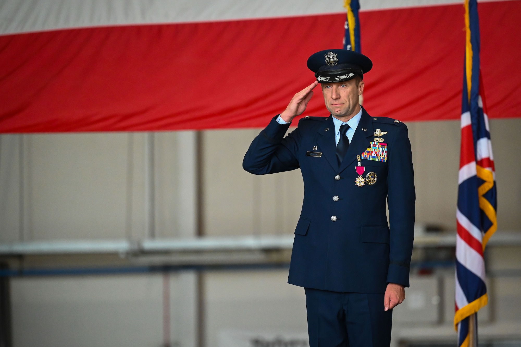 U.S. Air Force Col. Ryan J. Garlow, 100th Air Refueling Wing outgoing commander, receives his last salute as commander during the 100th ARW change of command ceremony at Royal Air Force Mildenhall, England, July 22, 2025.