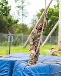 U.S. Army Pvt. Fatmata Kaikai, assigned to the 1067th Composite Truck Company, 228th Motor Transport Battalion, 213th Regional Support Group, Pennsylvania Army National Guard, climbs a rope during an obstacle course July 22, 2025, at Fort Indiantown Gap, Pennsylvania. The obstacle course challenges Soldiers’ physical stamina and is usually a precursor to the Air Assault School.