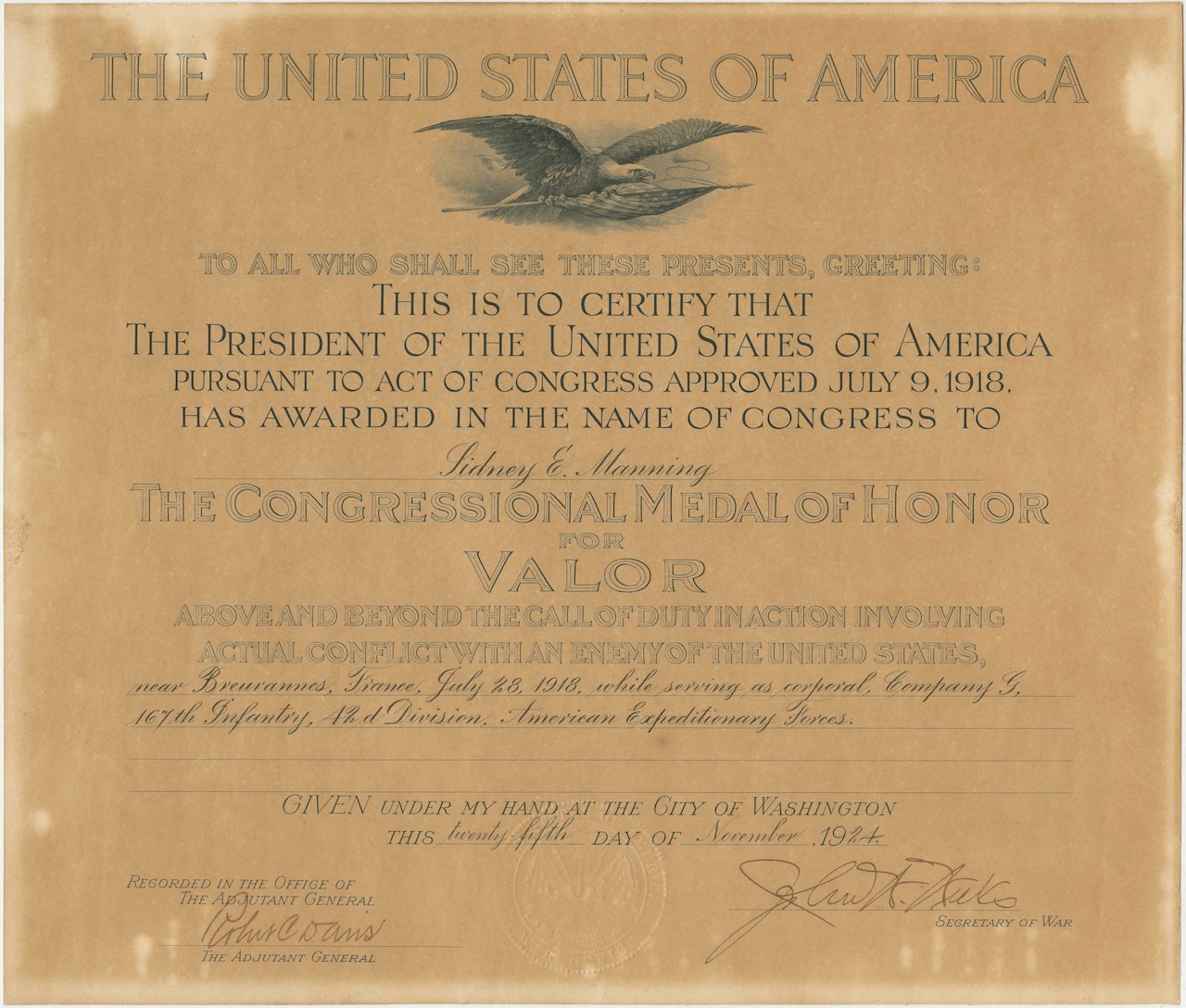 A yellowed paper certificate announces that Sidney E. Manning received the Medal of Honor.