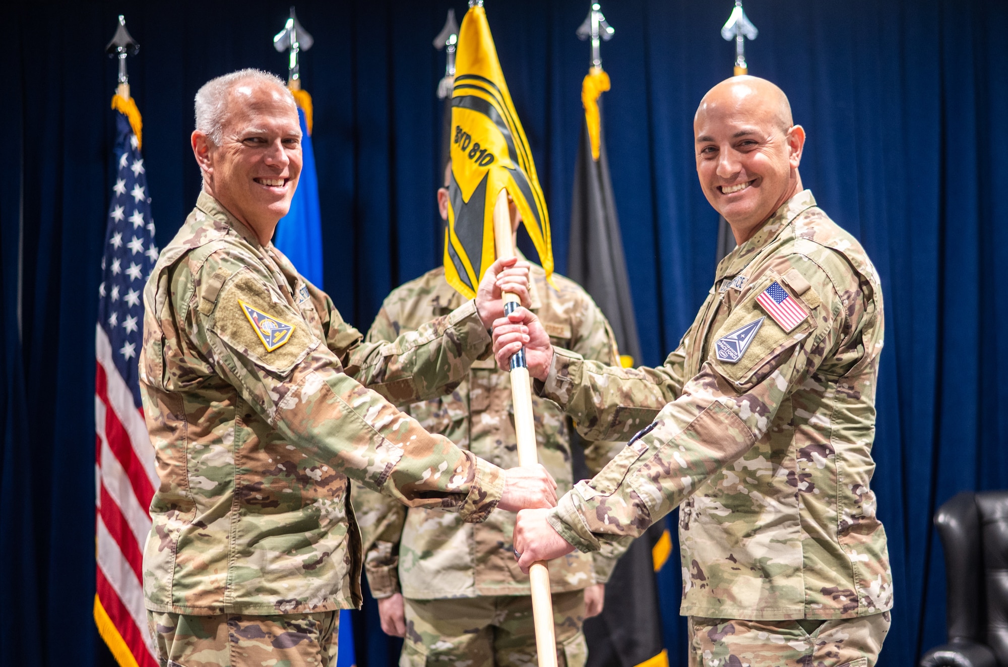 Lt. Gen. Philip A. Garrant, SSC commander passes the SYD 810 guidon to Col. Dane Bannach, commander, SYD 810, Space-Based Sensing & Targeting, officially activating the second Space Sensing System Delta in an Activation Ceremony at the Space Systems Command’s headquarters at Los Angeles Air Force Base, Jul. 10, 2025. [U.S. Space Force Photo by: Van Ha]