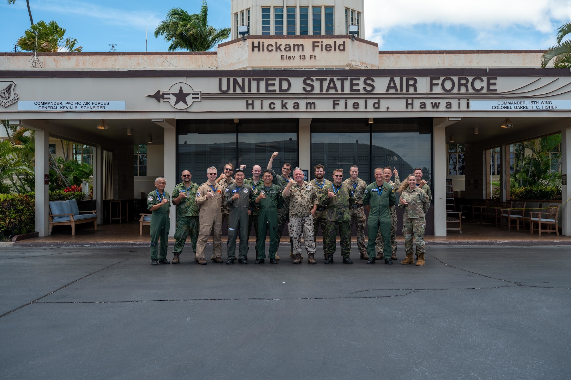 International Observer Program event participants pose for a group photo at the Hickam Field operations building at Joint Base Pearl Harbor-Hickam, Hawaii, July 18, 2025. The IOP event provided the international partner delegates with insight on how they could integrate into a future Resolute Force Pacific iteration, in an effort to encourage heightened efforts in maintaining security and stability in the Indo-Pacific. (U.S. Air Force photo by Senior Airman Mark Sulaica)