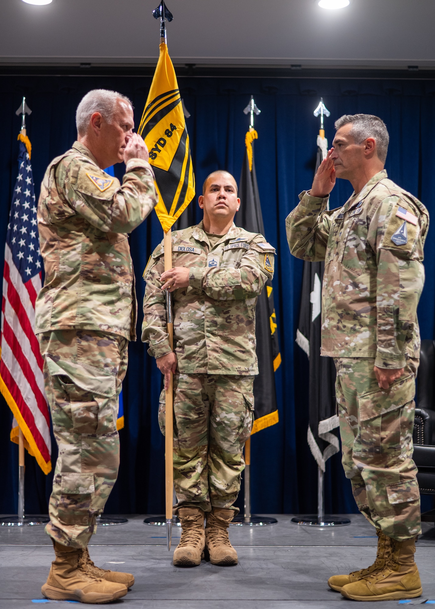 Col. Stevie Medeiros, commander, SSC System Delta 84, Space-Based Missile Warning and Tracking, salutes Lt Gen. Phillip A. Garrant, during the Space Sensing System Delta Activation Ceremony at the Space Systems Command’s headquarters at Los Angeles Air Force Base, Jul. 10, 2025. [U.S. Space Force Photo by: Van Ha]