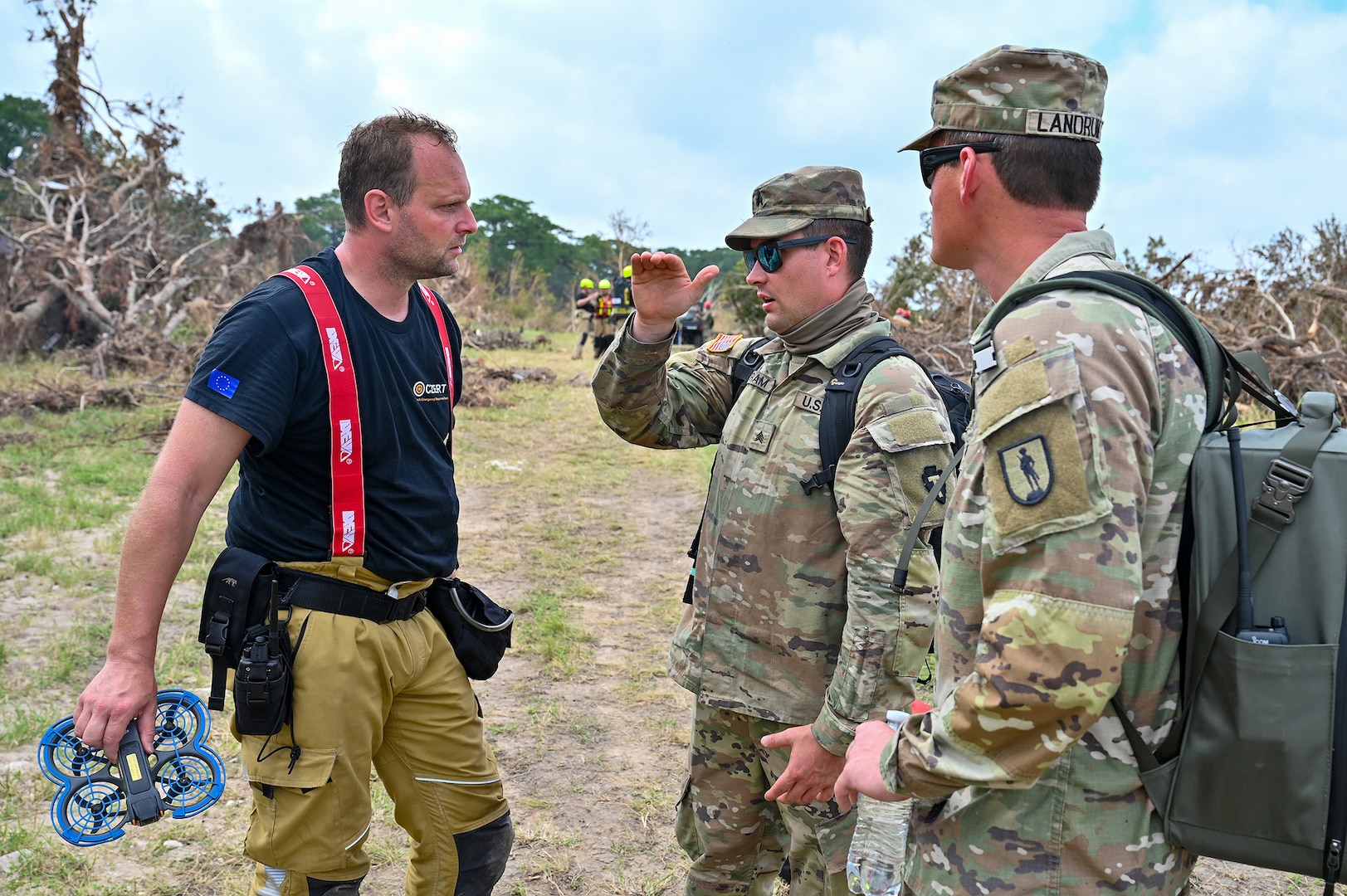 U.S. Army Capt. Stephen Landrum, right, and U.S. Army Sgt. Jason Bartram, a member of the 640th Small Unmanned Aerial Systems Detachment's Czech Republic emergency response team, takes part in flood response efforts along the Guadalupe River near Kerrville, Texas, on July 15, 2025.