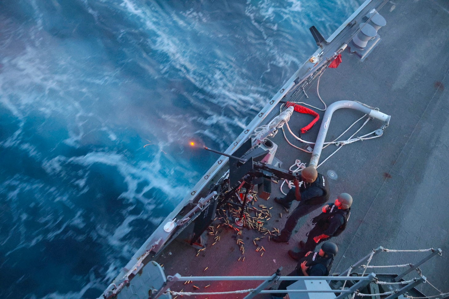 Gunner’s Mate 1st Class Don Dume, assigned to the Arleigh Burke-class guided-missile destroyer USS Bulkeley (DDG 84), fires the .50cal light machine-gun at an unmanned surface vessel during a live-fire exercise. USS Bulkeley is underway in the Atlantic Ocean with the Iwo Jima Amphibious Ready Group (ARG) participating in Composite Training Unit Exercise (COMPTUEX). COMPTUEX is the Department of the Navy’s commitment to deliver highly capable, integrated naval forces to promote our nation’s prosperity and security, deter aggression, and provide tailorable options to our nation’s leaders. COMPTUEX also allows the Navy to assess all aspects of prior readiness generation activities, which provides leaders information needed for process and resource allocation decisions for future warfighting development. (U.S. Navy photo by Mass Communication Specialist 2nd Class Jonathan Nye)