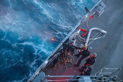 Gunner’s Mate 1st Class Don Dume, assigned to the Arleigh Burke-class guided-missile destroyer USS Bulkeley (DDG 84), fires the .50cal light machine-gun at an unmanned surface vessel during a live-fire exercise. USS Bulkeley is underway in the Atlantic Ocean with the Iwo Jima Amphibious Ready Group (ARG) participating in Composite Training Unit Exercise (COMPTUEX). COMPTUEX is the Department of the Navy’s commitment to deliver highly capable, integrated naval forces to promote our nation’s prosperity and security, deter aggression, and provide tailorable options to our nation’s leaders. COMPTUEX also allows the Navy to assess all aspects of prior readiness generation activities, which provides leaders information needed for process and resource allocation decisions for future warfighting development. (U.S. Navy photo by Mass Communication Specialist 2nd Class Jonathan Nye)
