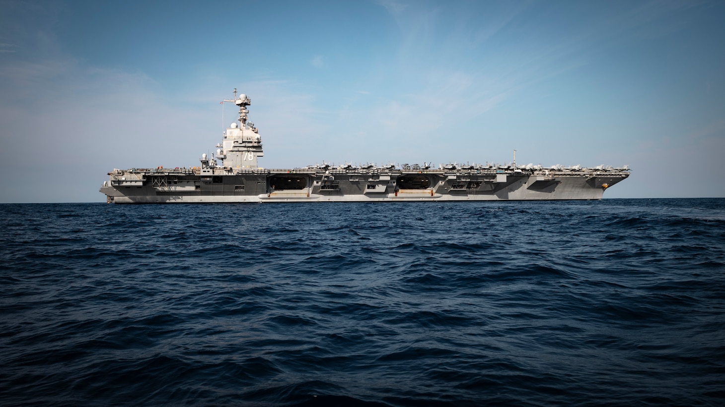 The world's largest aircraft carrier, USS Gerald R. Ford (CVN 78), sails in the Atlantic Ocean, July 4, 2025. Gerald R. Ford, a first-in-class aircraft carrier and deployed flagship of Carrier Strike Group Twelve, incorporates modern technology, innovative shipbuilding designs, and best practices from legacy aircraft carriers to increase the U.S. Navy's capacity to underpin American security and economic prosperity, deter adversaries, and project power on a global scale through sustained operations at sea. (U.S. Navy photo by Mass Communication Specialist 2nd Class Tajh Payne)