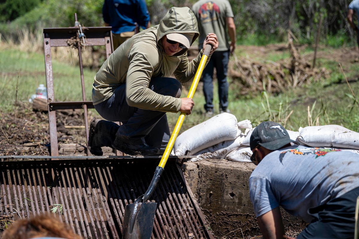 U.S. Air Force Senior Airman Jacob Maldonado, 7th Air Support Operations Squadron tactical air control party specialist, cleans a grate at Mescalero, New Mexico, July 19, 2025.