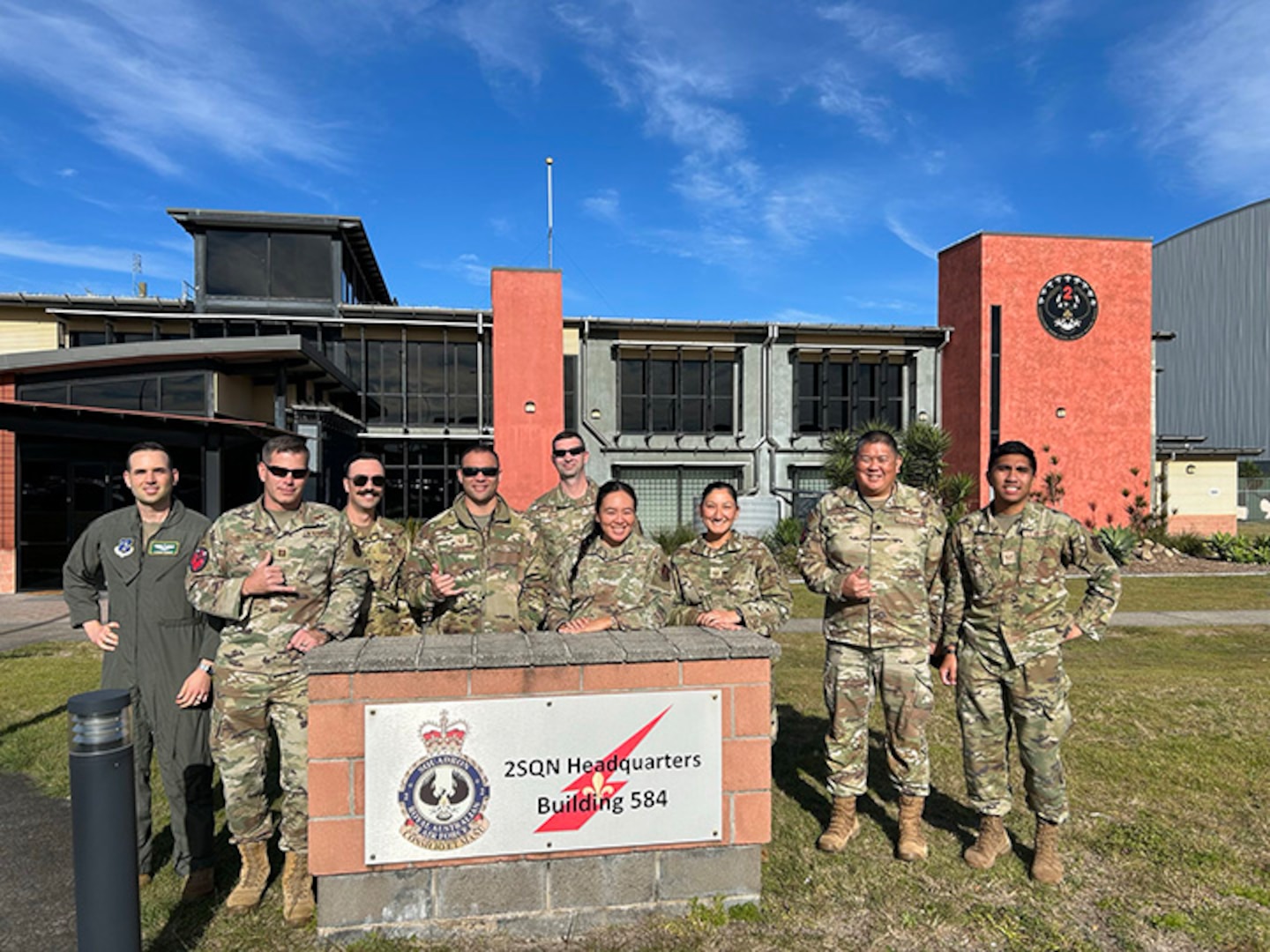 Western Air Defense Sector and Pacific Air Defense Sector teams pose at the 2nd Squadron "WEDGETAIL" building, RAAF Base Williamtown, New South Wales, Australia, July 16, 2025.