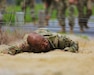 A U.S. Soldier with the 213th Regional Support Group, Pennsylvania National Guard, scales an obstacle on the confidence course at Fort Indiantown Gap, Pennsylvania, July 22, 2025.