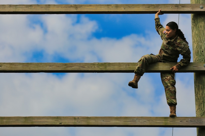 U.S. Army Staff Sgt. Melyssa Vazquez, a public affairs specialist with the 213th Regional Support Group, Pennsylvania National Guard, scales an obstacle on the confidence course at Fort Indiantown Gap, Pennsylvania, July 22, 2025.