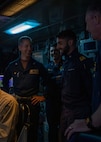Destroyer Squadron Two Commodore, Capt. Mark Lawrence, left, speaks with Italian Navy Lt. Gabriel Petri, second from the right, a liaison officer from ITS Spartaco Schergat (F598), and other members of the DESRON-2 staff while in USS Gerald R. Ford's (CVN 78) Surface Undersea Combat Center, July 23, 2025. DESRON-2, a part of Carrier Strike Group Twelve, is currently deployed in the U.S. 6th Fleet area of operations to support the warfighting effectiveness, lethality and readiness of U.S. Naval Forces Europe-Africa, and defend U.S., Allied and partner interests in the region. (U.S. Navy photo by Mass Communication Specialist 2nd Class Mariano Lopez)