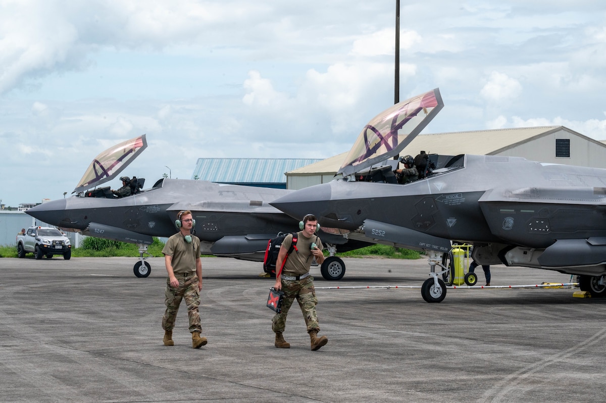 U.S. Air Force maintainers, assigned to the 421st Mission Generation Force Element, depart the flightline after conducting preflight operations on an F-35A Lightning II during Cope Thunder 25-2 at Clark Air Base, Philippines, July 7, 2025. The exercise enhances interoperability between the U.S. Air Force and the Philippine Air Force and supported the Armed Forces of the Philippines' modernization efforts. (U.S. Air Force photo by Airman 1st Class Aden Brown)