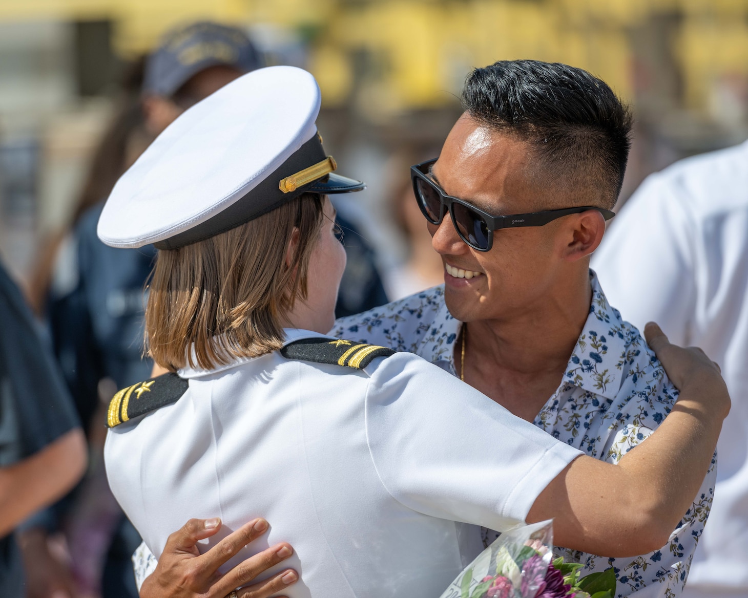 JOINT BASE PEARL HARBOR-HICKAM, Hawaii (July 22, 2025) - A Sailor assigned to the Virginia-class fast-attack submarine USS Indiana (SSN 789) greets her husband as Indiana arrives at Joint Base Pearl Harbor-Hickam during its change of homeport, July 22, 2025. Indiana is assigned to Submarine Squadron 7 and is capable of supporting various missions, including anti-submarine warfare, anti-surface ship warfare, strike warfare, and intelligence, surveillance, and reconnaissance. (U.S. Navy photo by Mass Communication Specialist 1st Class Scott Barnes)