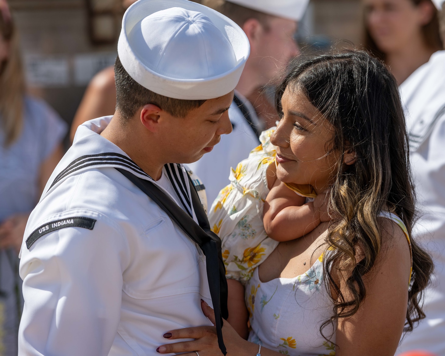 JOINT BASE PEARL HARBOR-HICKAM, Hawaii (July 22, 2025) - A Sailor assigned to the Virginia-class fast-attack submarine USS Indiana (SSN 789) greets his family as Indiana arrives at Joint Base Pearl Harbor-Hickam during its change of homeport, July 22, 2025. Indiana is assigned to Submarine Squadron 7 and is capable of supporting various missions, including anti-submarine warfare, anti-surface ship warfare, strike warfare, and intelligence, surveillance, and reconnaissance. (U.S. Navy photo by Mass Communication Specialist 1st Class Scott Barnes)