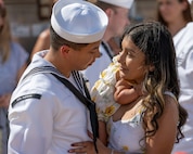 JOINT BASE PEARL HARBOR-HICKAM, Hawaii (July 22, 2025) - A Sailor assigned to the Virginia-class fast-attack submarine USS Indiana (SSN 789) greets his family as Indiana arrives at Joint Base Pearl Harbor-Hickam during its change of homeport, July 22, 2025. Indiana is assigned to Submarine Squadron 7 and is capable of supporting various missions, including anti-submarine warfare, anti-surface ship warfare, strike warfare, and intelligence, surveillance, and reconnaissance. (U.S. Navy photo by Mass Communication Specialist 1st Class Scott Barnes)