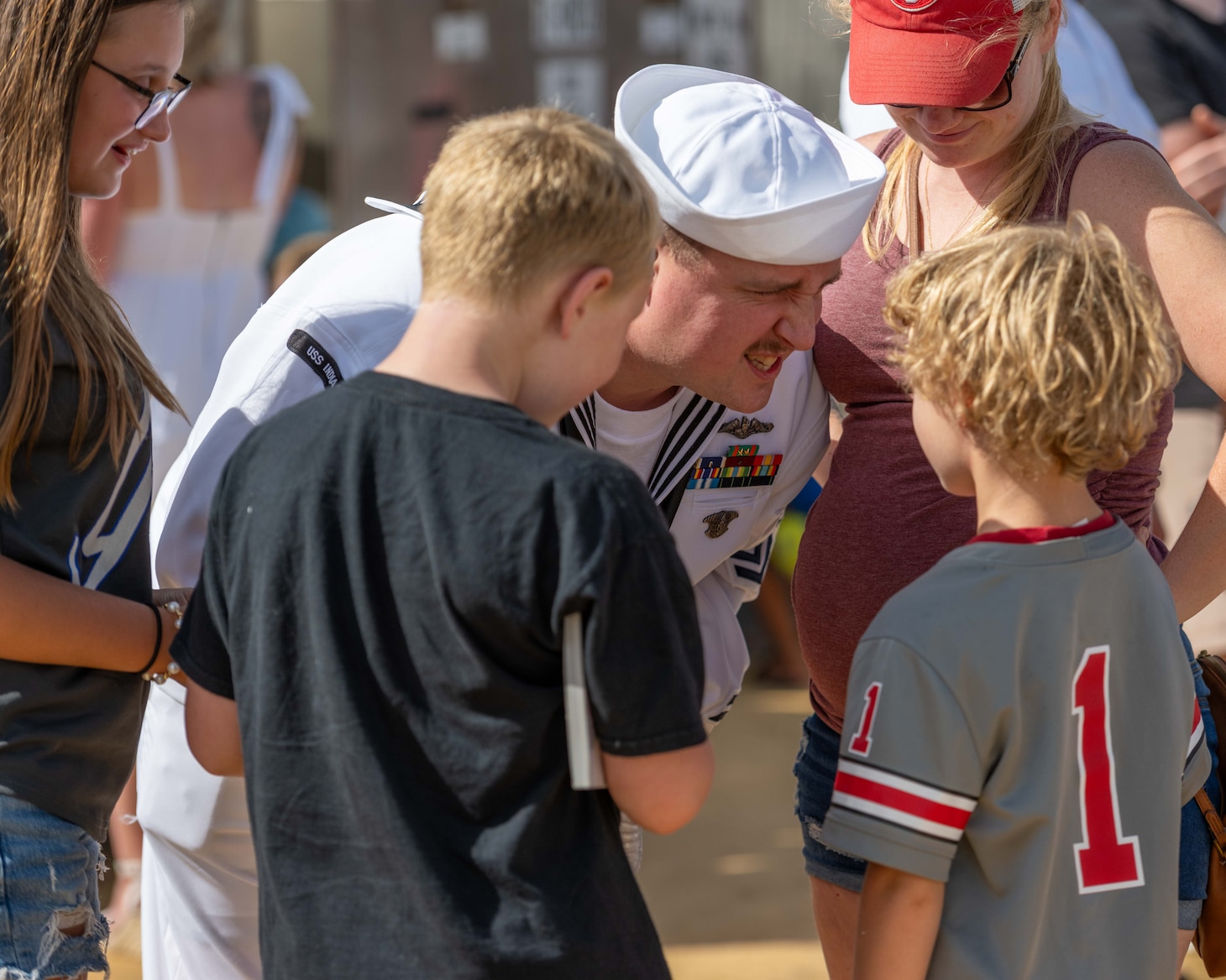 JOINT BASE PEARL HARBOR-HICKAM, Hawaii (July 22, 2025) - A Sailor assigned to the Virginia-class fast-attack submarine USS Indiana (SSN 789) greets his family as Indiana arrives at Joint Base Pearl Harbor-Hickam during its change of homeport, July 22, 2025. Indiana is assigned to Submarine Squadron 7 and is capable of supporting various missions, including anti-submarine warfare, anti-surface ship warfare, strike warfare, and intelligence, surveillance, and reconnaissance. (U.S. Navy photo by Mass Communication Specialist 1st Class Scott Barnes)
