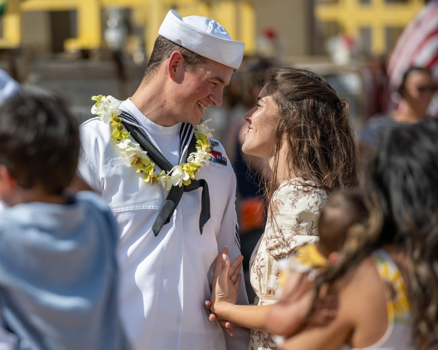 JOINT BASE PEARL HARBOR-HICKAM, Hawaii (July 22, 2025) - A Sailor assigned to the Virginia-class fast-attack submarine USS Indiana (SSN 789) greets his wife as Indiana arrives at Joint Base Pearl Harbor-Hickam during its change of homeport, July 22, 2025. Indiana is assigned to Submarine Squadron 7 and is capable of supporting various missions, including anti-submarine warfare, anti-surface ship warfare, strike warfare, and intelligence, surveillance, and reconnaissance. (U.S. Navy photo by Mass Communication Specialist 1st Class Scott Barnes)
