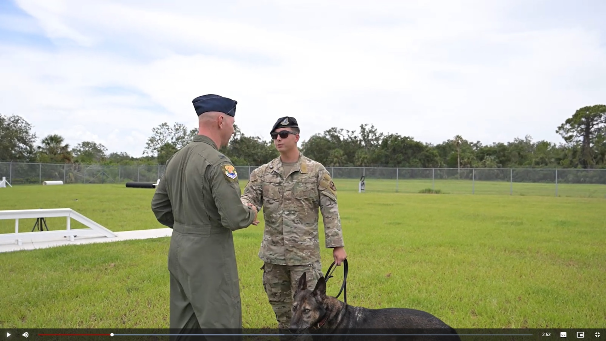 U.S. Air Force Col. Edward Szczepanik, 6th Air Refueling Wing Commander, recognizes Senior Airman Jeremy Francisco, a military working dog handler assigned to the 6th Security Forces Squadron, during a game of catch at MacDill Air Force Base, Florida, July 18, 2025. As a patrol unit, Francisco and his K-9 partner, Golyko, respond to a wide range of situations at a moment’s notice. They rely on the rigorous training both handlers and Military Working Dogs receive to make quick, sound decisions that protect personnel and secure the installation. (U.S. Air Force photo by Airman 1st Class Monique Stober)