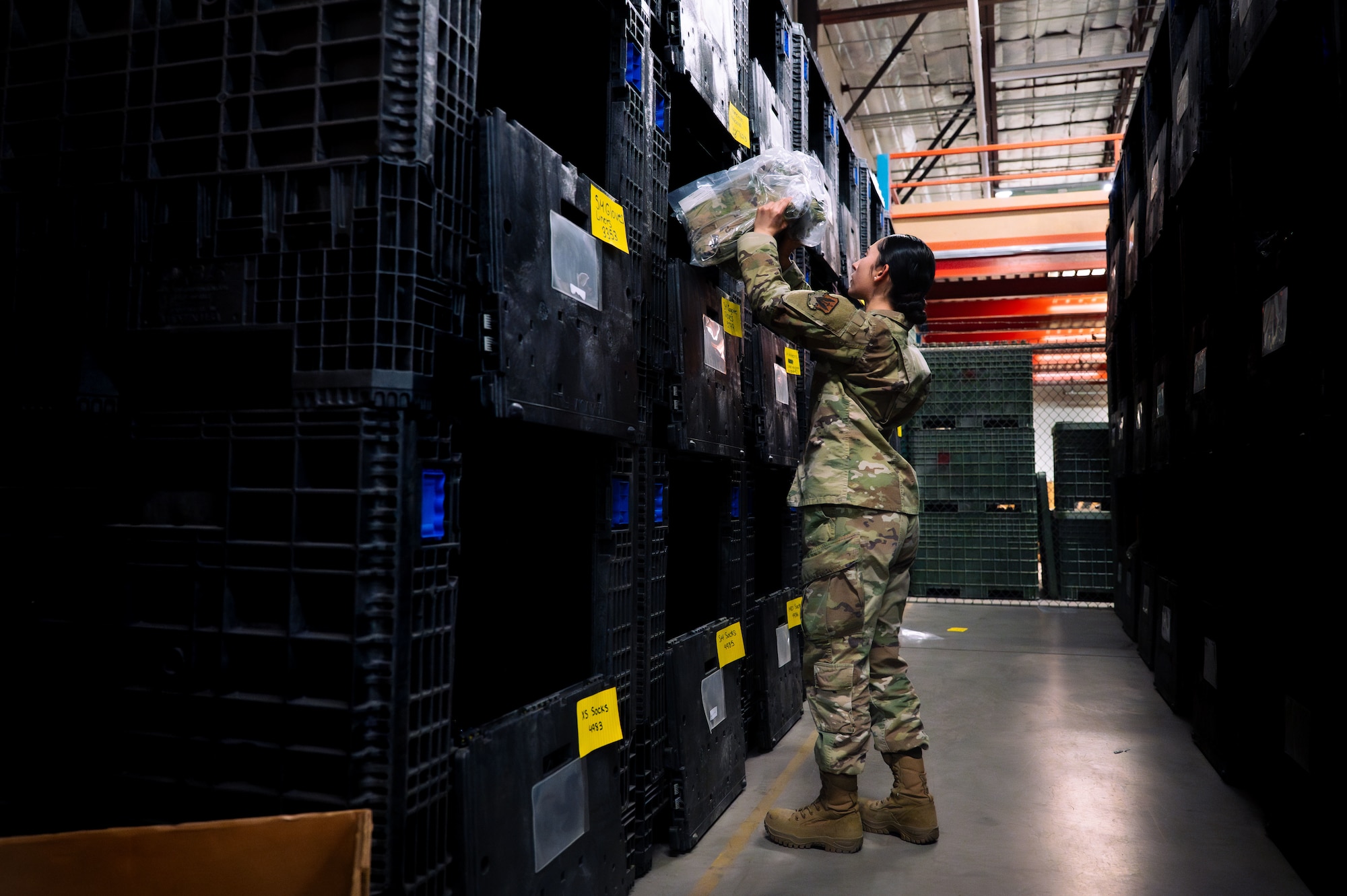 U.S. Air Force Airman 1st Class Jianna Amado, 355th Logistics Readiness Squadron material manager, organizes equipment at Davis-Monthan Air Force Base, Arizona, July 22, 2025. LRS Airmen maintain and distribute essential gear to support mission readiness. (U.S. Air Force photo by Senior Airman Jasmyne Bridgers-Matos)