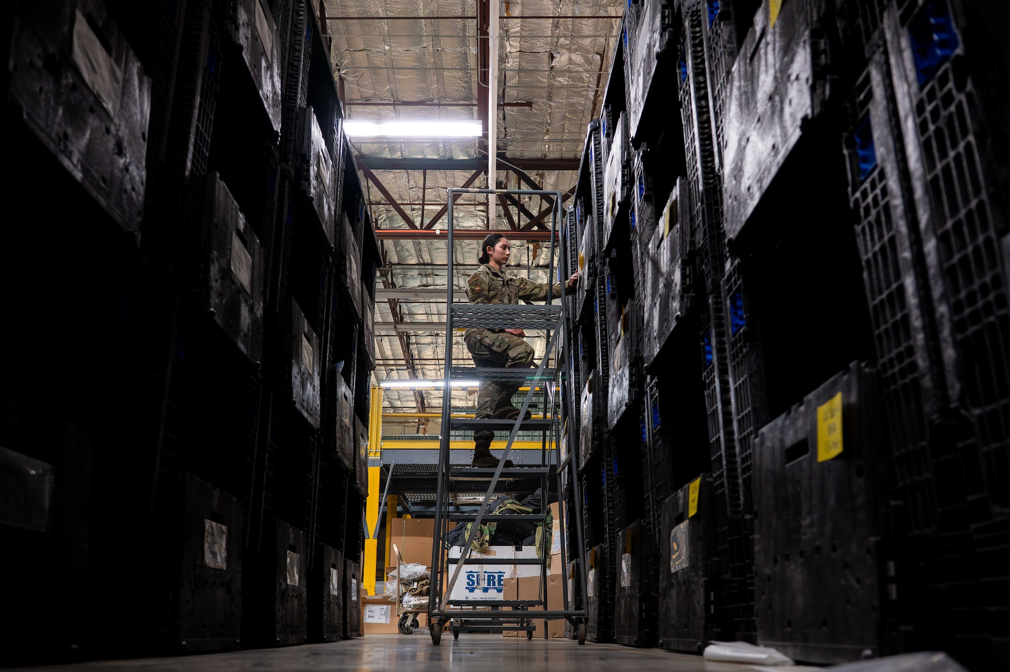 U.S. Air Force Airman 1st Class Jianna Amado, 355th Logistics Readiness Squadron material manager, conducts inventory at Davis-Monthan Air Force Base, Arizona, July 22, 2025. Airmen maintain a log of all individual protective equipment both in the warehouse and signed out to Airmen. (U.S. Air Force photo by Senior Airman Jasmyne Bridgers-Matos)