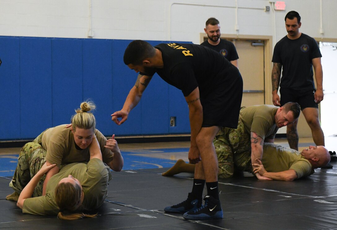 U.S. Airmen assigned to the Air Force District of Washington receive combative training from 816th Security Forces Squadron Phoenix Ravens during AFDW Readiness Day at Joint Base Andrews, Md., July 18, 2025.