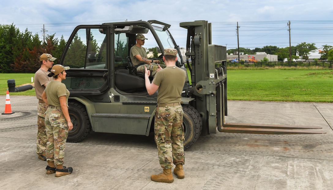 U.S. Airmen assigned to the Air Force District of Washington receive forklift familiarization training from 316th Logistics Readiness Squadron personnel during AFDW Readiness Day at Joint Base Andrews, Md., July 18, 2025.