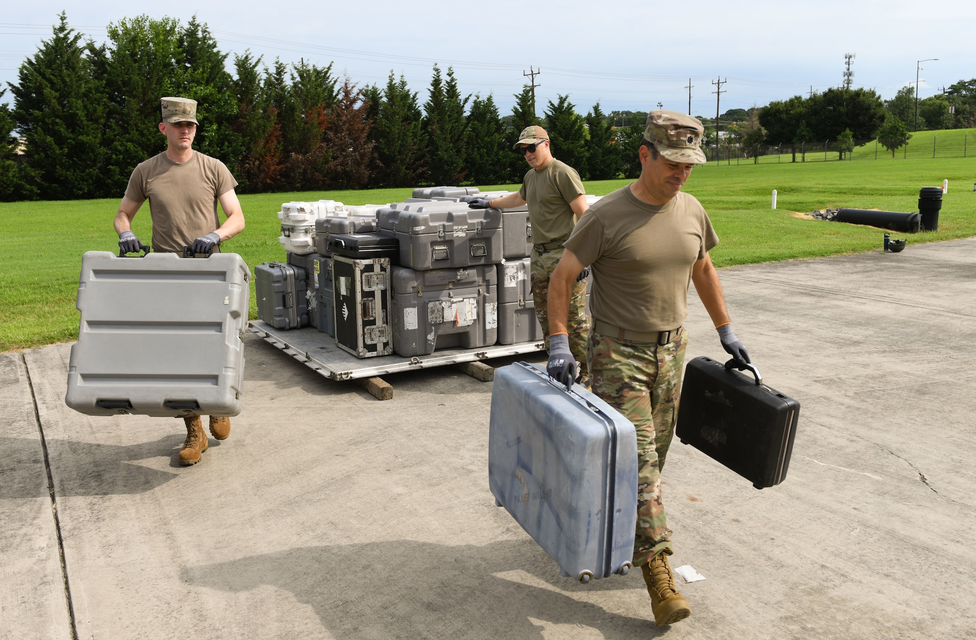U.S. Airmen assigned to the Air Force District of Washington unload equipment during AFDW Readiness Day at Joint Base Andrews, Md., July 18, 2025.