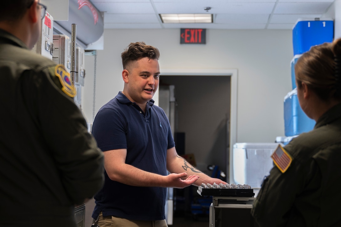Airmen demonstrating 3D-printed tray