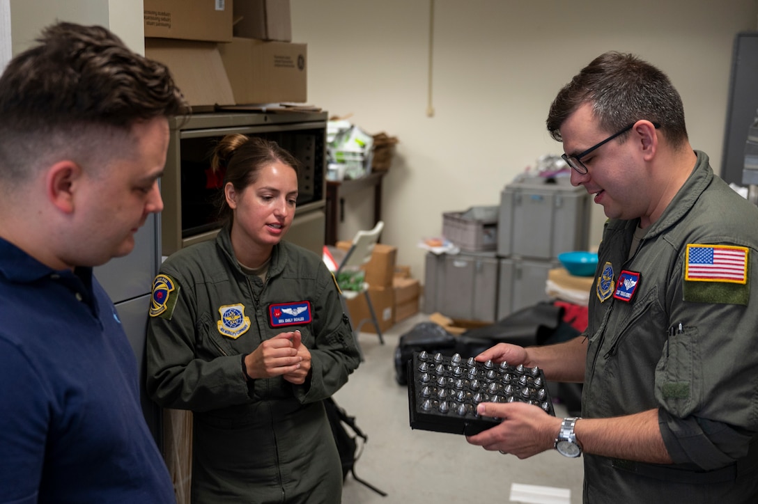 Airmen demonstrating 3D-printed tray